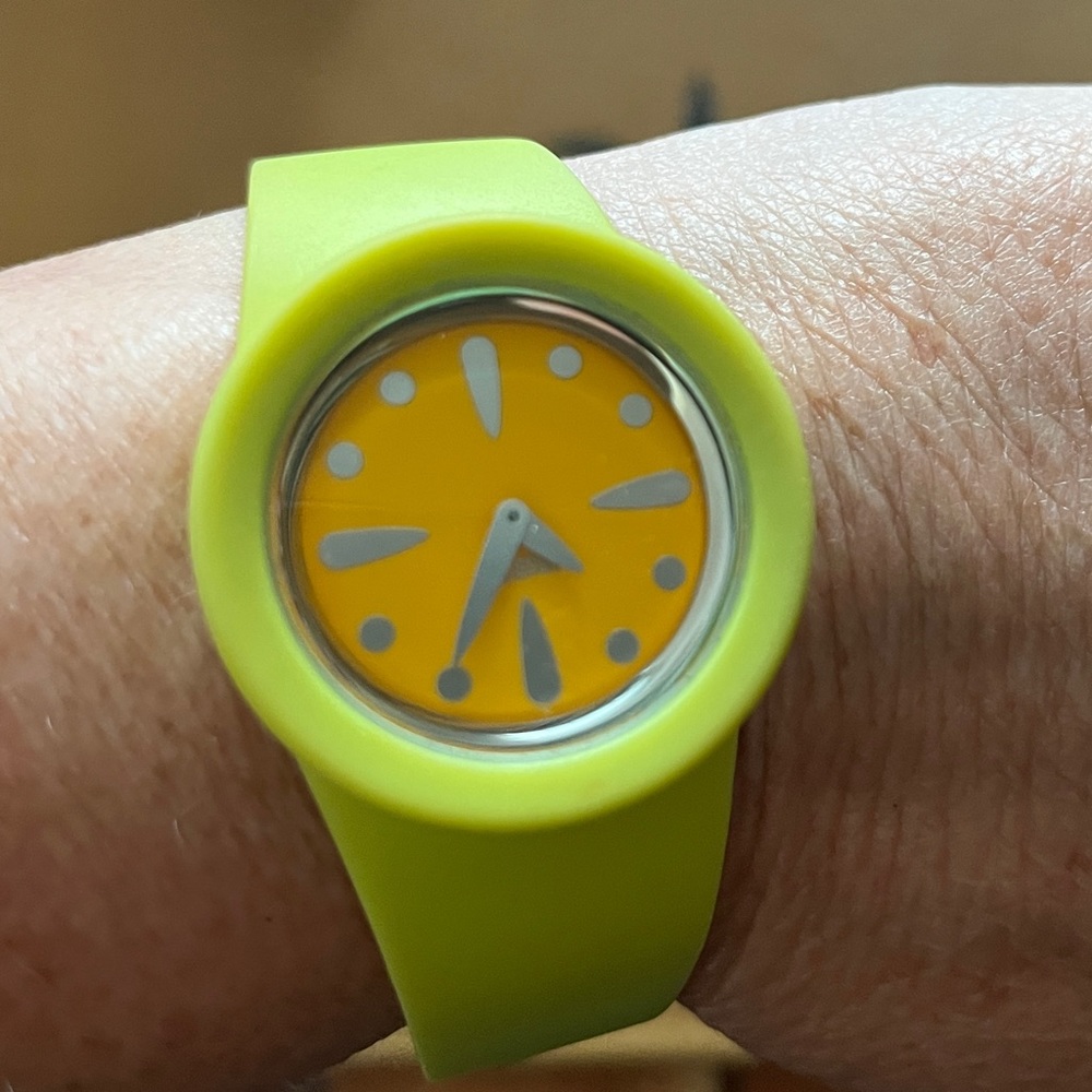 Apple green and mustard yellow rubber Alessi watch.